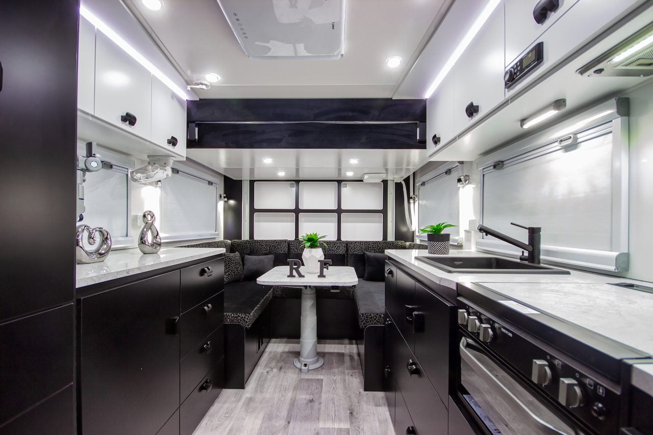 Royal Flair Aussiemate luxury caravan, featuring a cozy kitchen, ample natural light, and smart storage