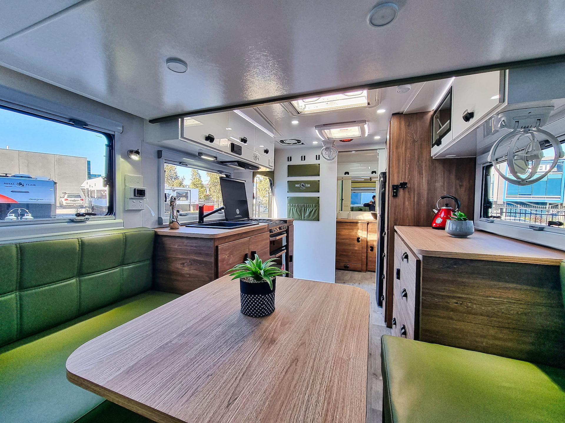 The Royal Flair Aussiemate caravan merges luxury with practicality, offering a warm kitchen, light-filled spaces, and neat storage