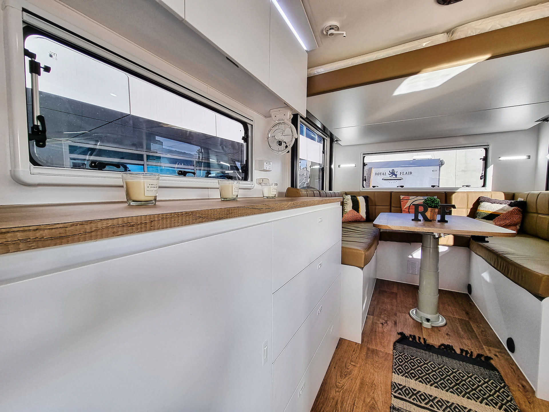 The Aussiemate caravan's interior features a versatile dropdown bed, merging luxury with smart build